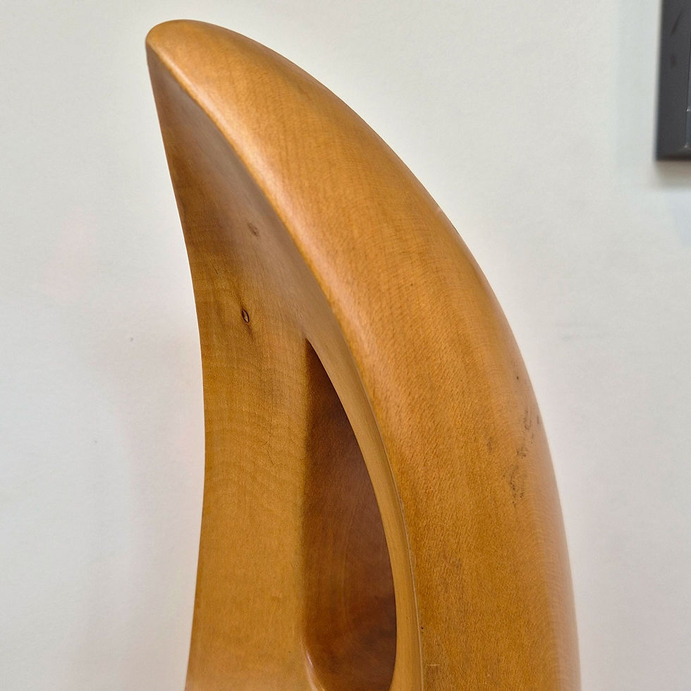 A fluid Modernist artist study sculpture in Lime wood, surrealist form - detail view