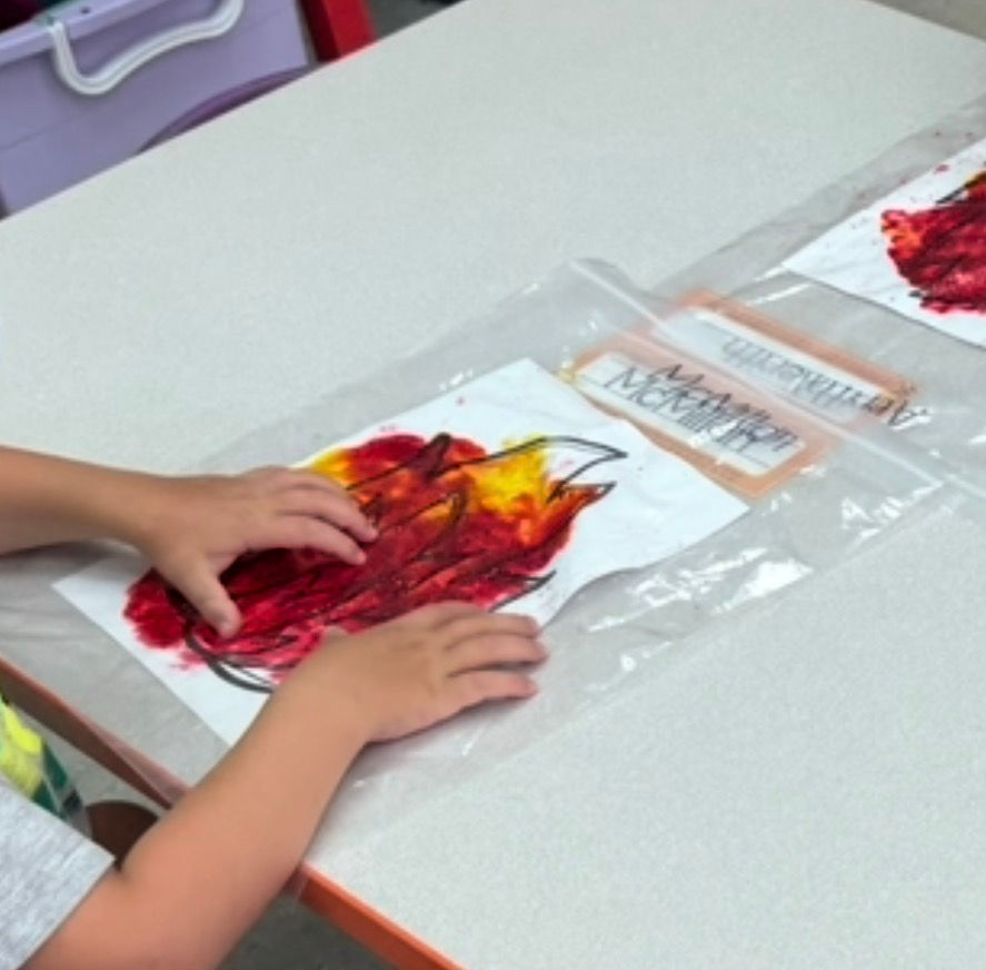 preschooler practicing fine motor skills and color mixing