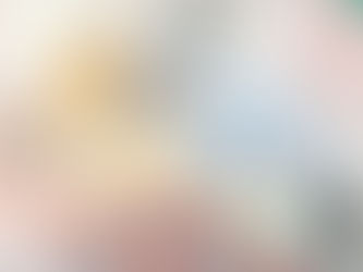 Pills in various colors spill from bottles, surrounded by blister packs and a syringe. Vials with green caps are in the background.