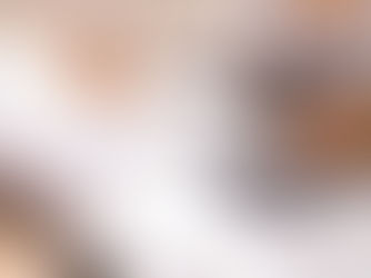 Person doing taxes wtih calculator and binder