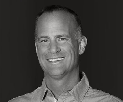 Smiling man in black and white