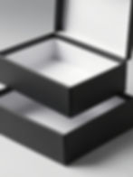 Open black gift-box reference with a hinged lid and white interior.