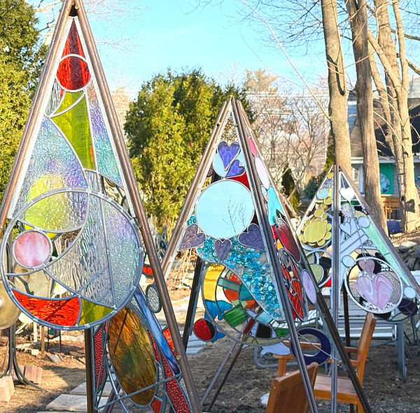 3 pyramids in garden.jpg