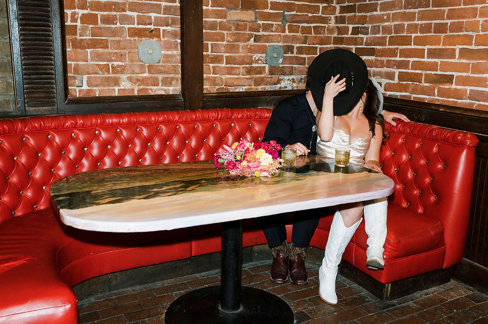 bride and groom in booth