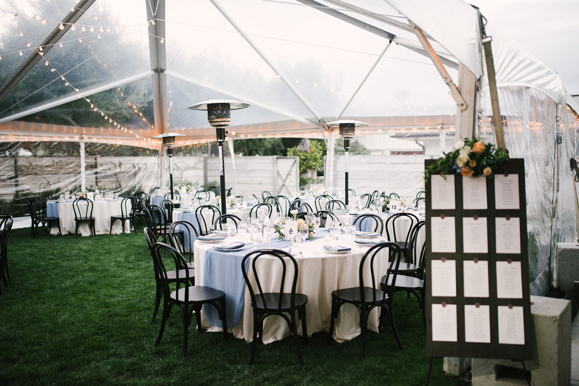 tables under covered tent for reception