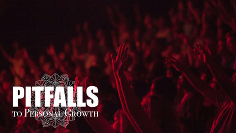 Pitfalls to Personal Growth: An image of a crowd with raised hands