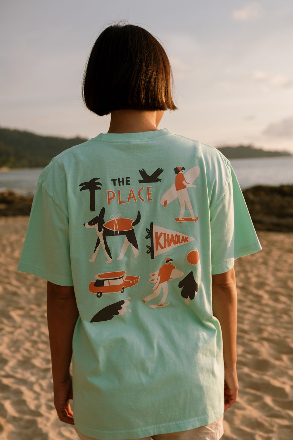 Thumbnail: The Place x Kookumbra Sandy T-Shirt + Sticker Set