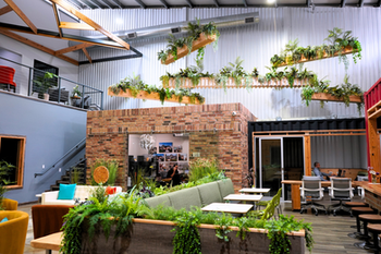Coworking lounge and shared workspace amenities at Cubic Cowork in Spring, TX