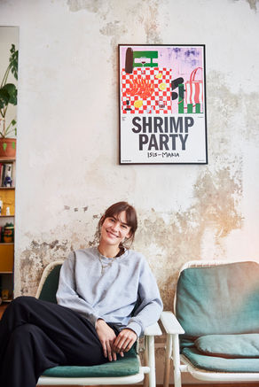 young woman sitting on old chairs infront of old shabby wall