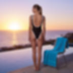 Model wearing the Midnight Edge Tan Through Swimsuit from Revyl and Rav