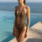 woman wearing the Sahara Chic Tan Through swimsuit from Revyl and Rav