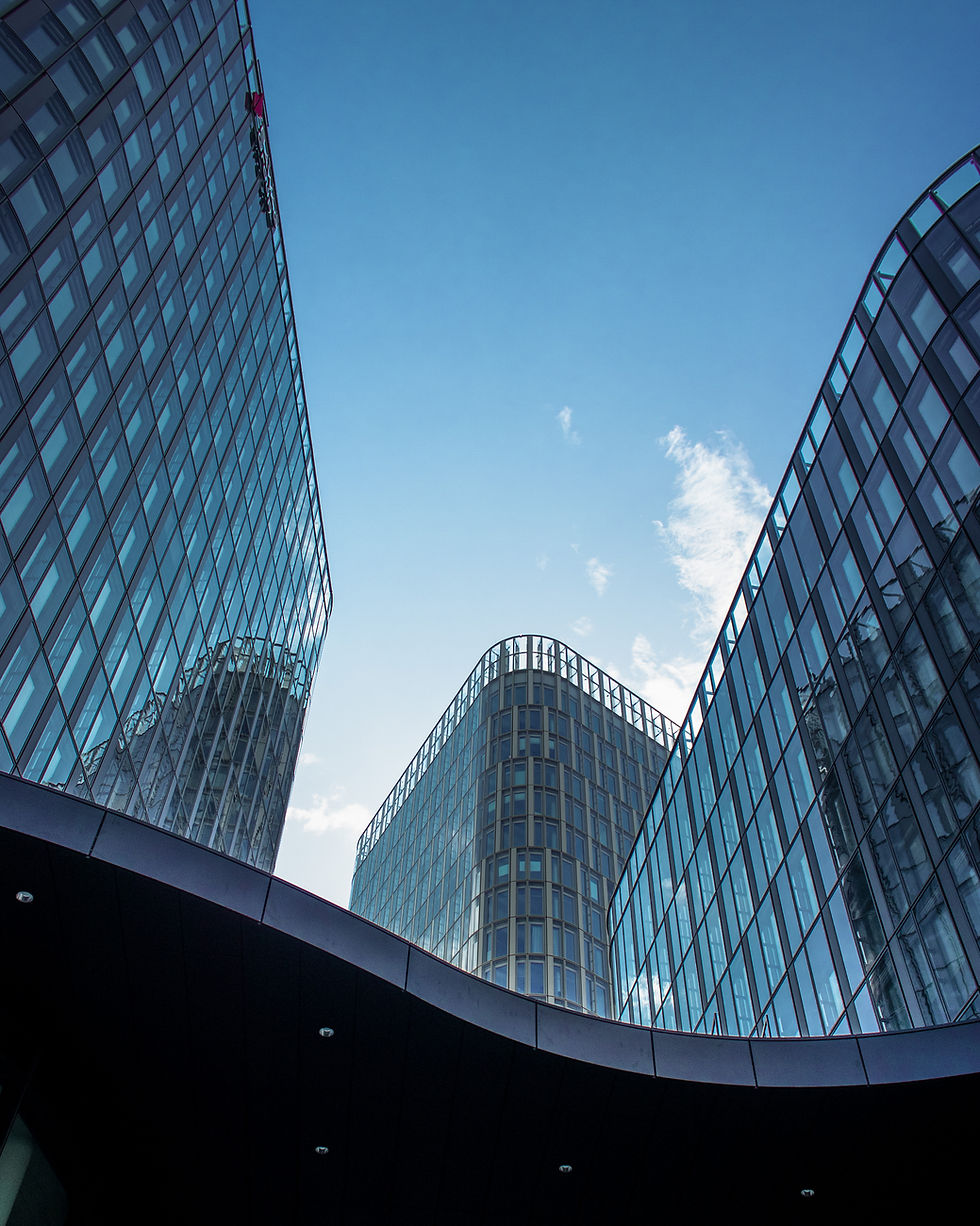 vertical-shot-modern-office-buildings-with-big-reflective-windows-sunlight.jpg