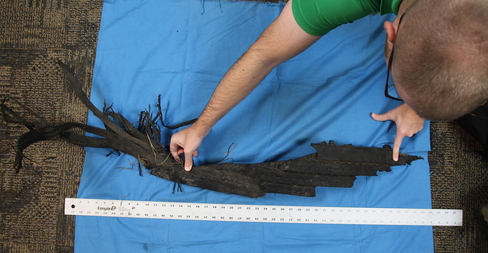Measuring a peice of tire tread evidence recovered from an accident scene.