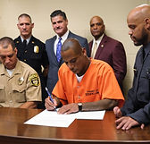 inmate signing.jpg