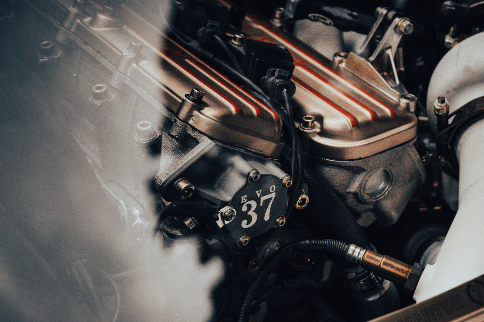 Kimera EVO37 twin-charged inline-four engine with the number 37 on the cam cover
