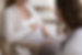 Hand of unknown obstetrician touches big belly of pregnant woman during visit at home, clo
