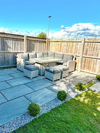 Kandle Grey indina stone patio, with decorative stone and small bushes