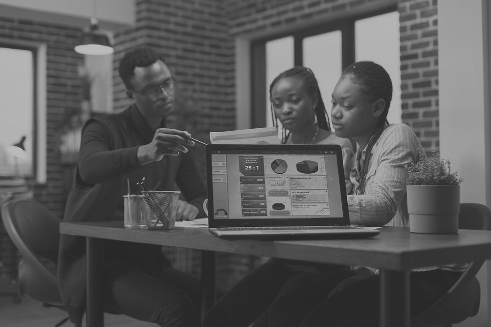 Digital marketing agency team discussing social media management and website design strategies for small businesses – Intuned