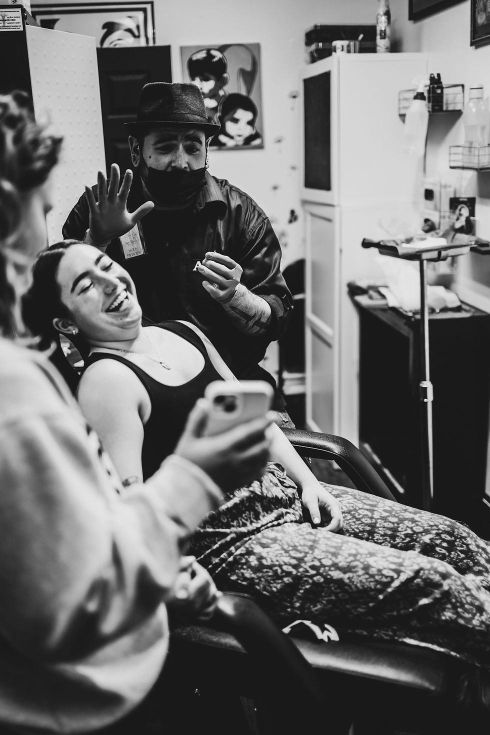 Adam the Piercer making a client laugh