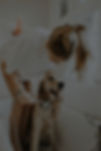woman bathing dog in bathtub_edited.jpg