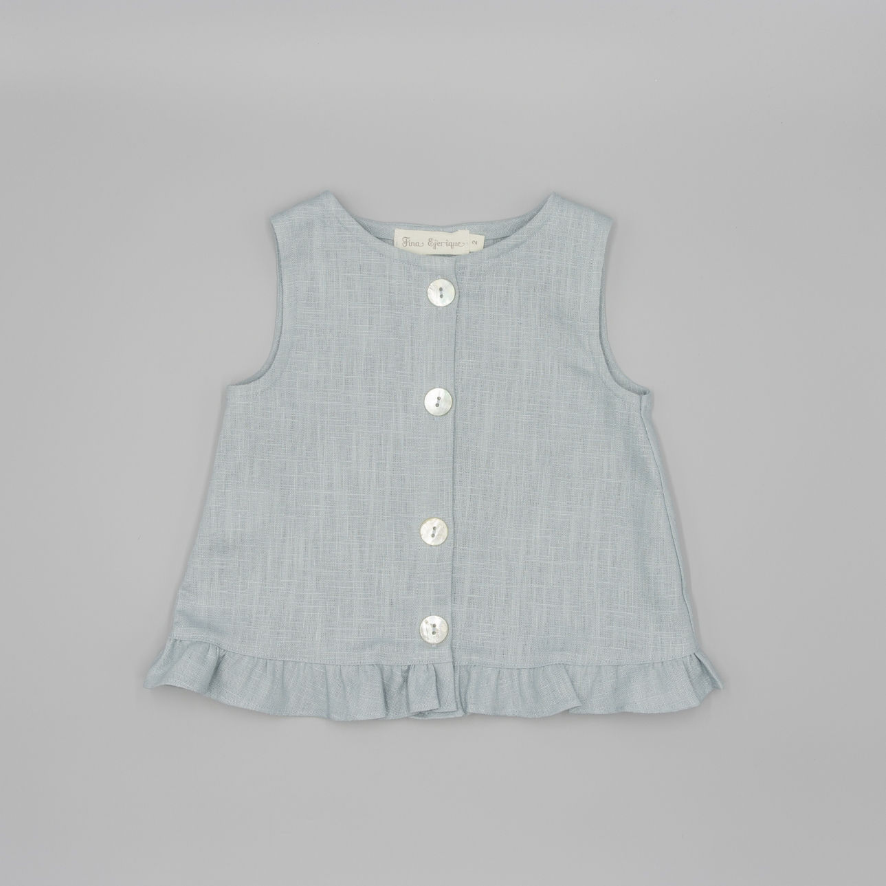 BLUSA LINO CON VOLANTE EN BAJO Y BOTONES NACAR