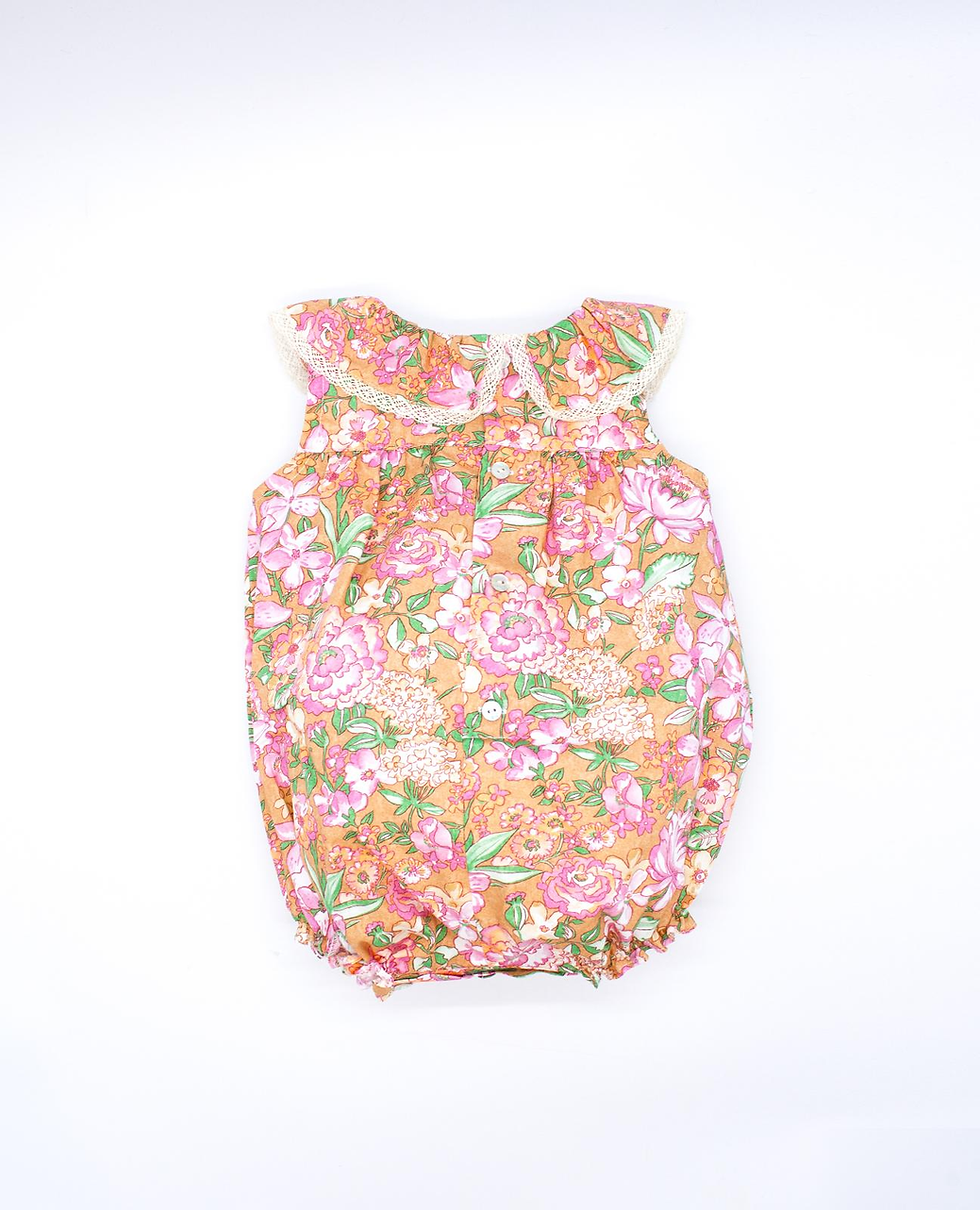 Miniatura: Pelele volante ocre con flor rosa