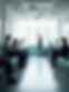 A typical busy medical clinic waiting room with several patients seated, conveying a sense