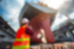 Guy in safety vest bottom of giant boat on radio.jpeg