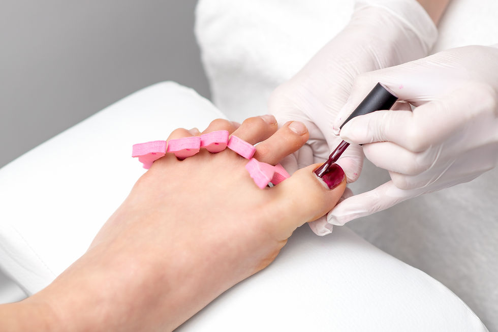 pedicurist-painting-red-nail-polish-female-toenail.jpg