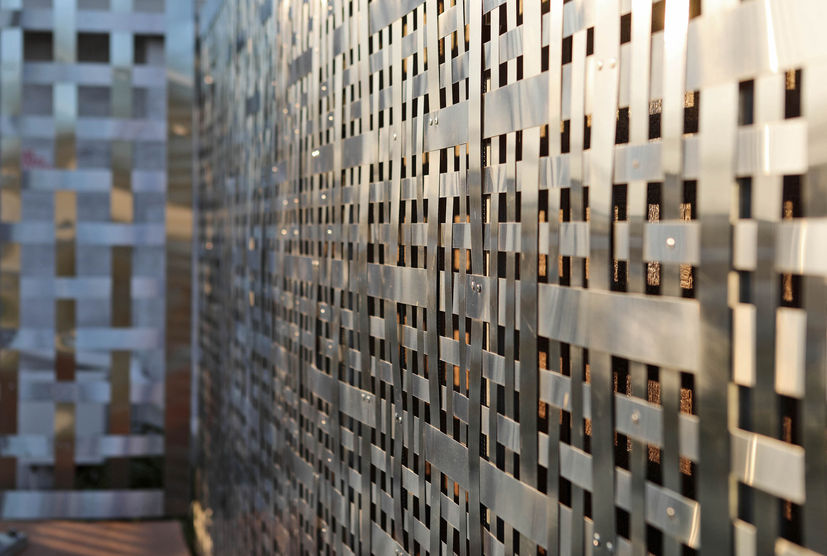 Fine detailing of woven stainless steel facade designed and installed as an architectural art piece.