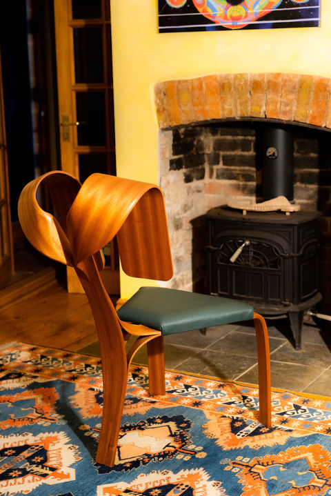 This artistic bespoke chair is made using a twisted lamination technique. It is made from sapele. It is produced by vacuum bag lamination technique inspired by the work of Joseph Walsh.