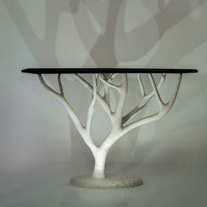 Organic modern furniture table with sculpted sycamore base and charred ash top, inspired by bleached coral and wildfire-scorc