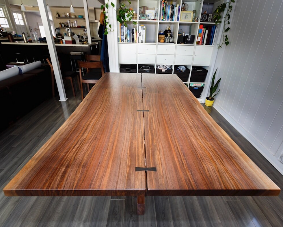 Solid walnut desk tops joined with bowties, example of custom wood furniture construction and stability.