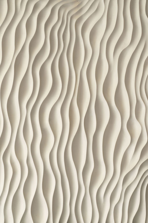 Close up of Jesmonite wall art panel with textured, kelp-inspired carving, showcasing organic sculptural detail and natural light play.
