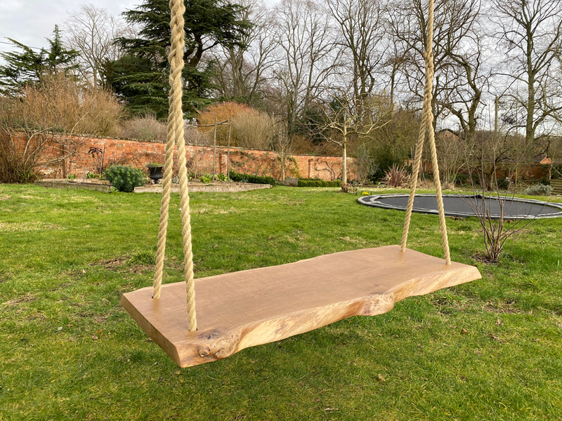 A beautiful solid oak swing designed for two people
