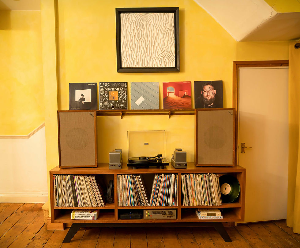 A bespoke hifi cabinet with turntable, vinyl storage and tannoy speakers. Made from solid utile.