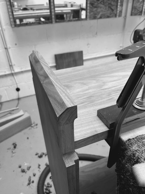 Shows making process in Oxford workshop of bespoke HiFi cabinet in solid walnut