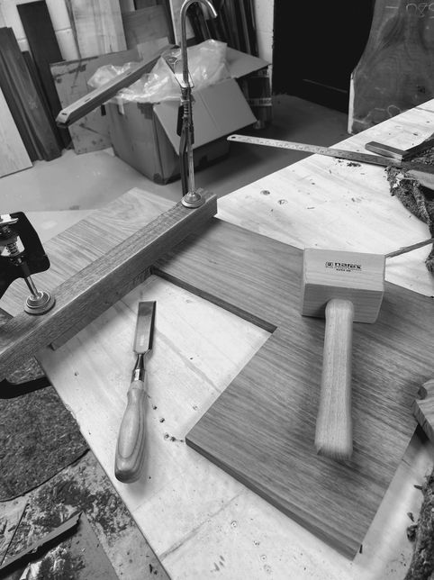 Shows making process in Oxford workshop of bespoke HiFi cabinet in solid walnut