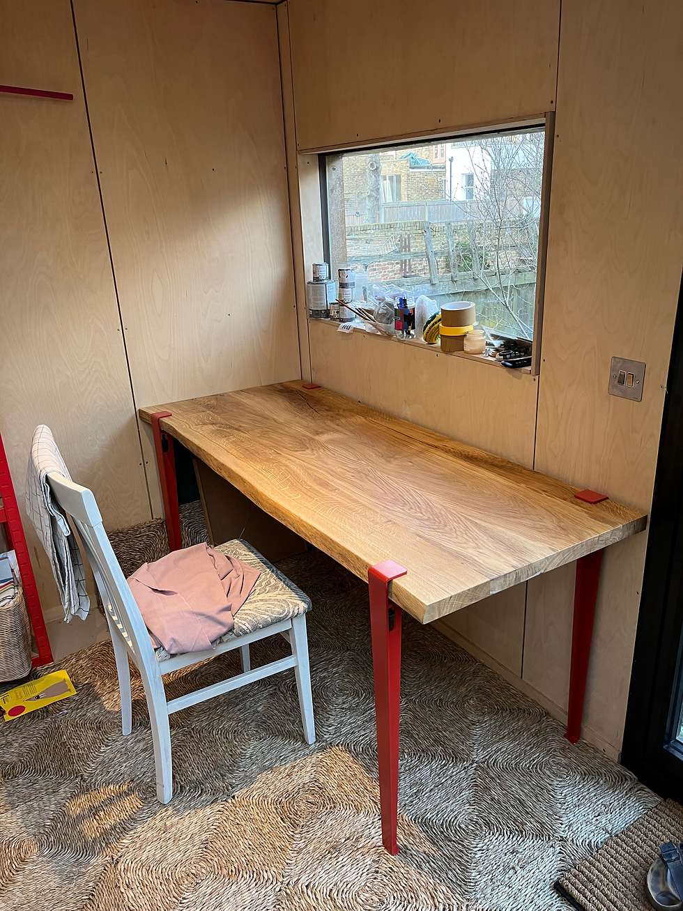 Minimalist oak wooden desk with natural edges and minimalist metal legs, designed as his-and-hers home office desks.