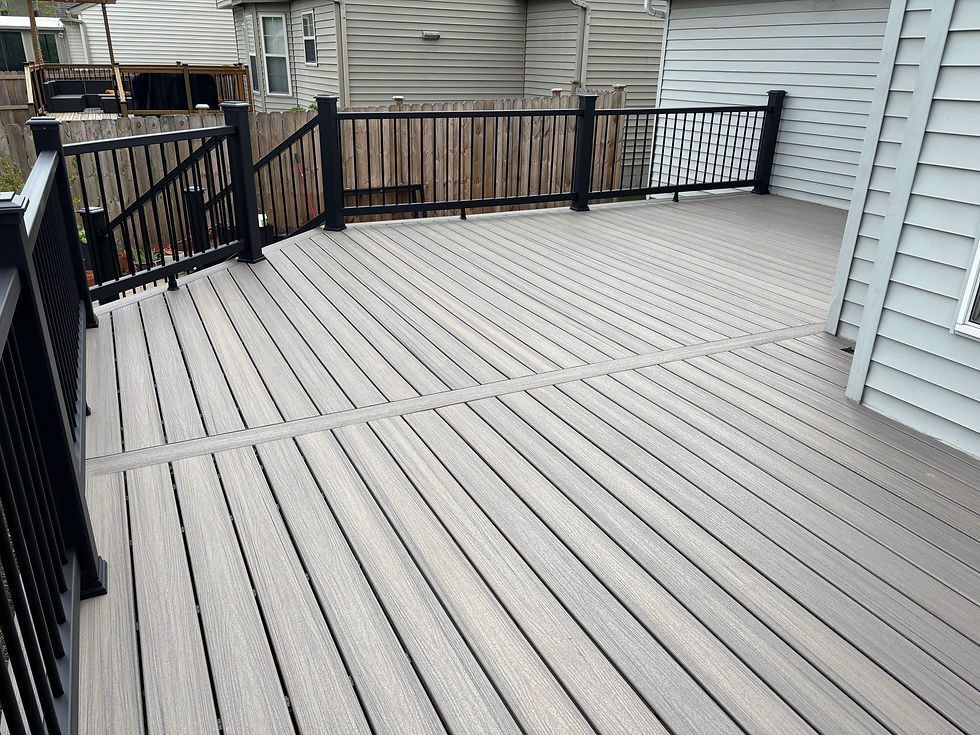 Eye-level view of composite decking boards in various wood tones