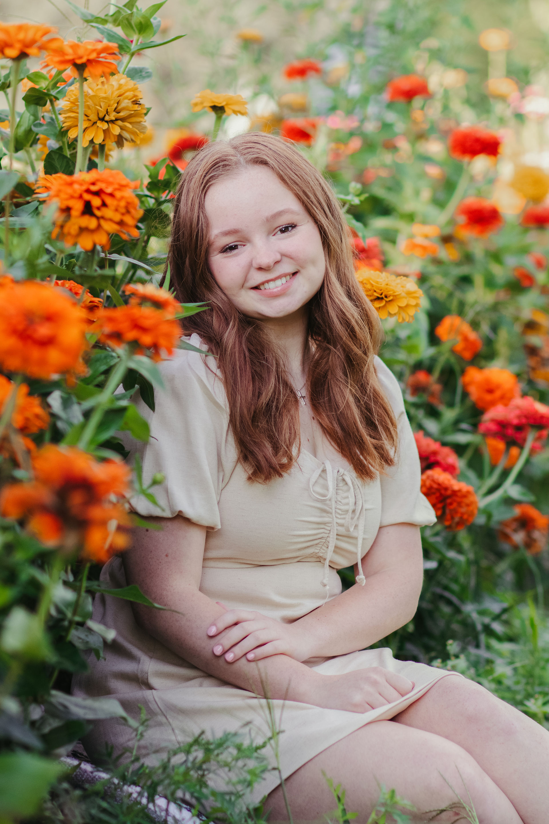 Senior photos in Syracuse in a flower field at golden hour