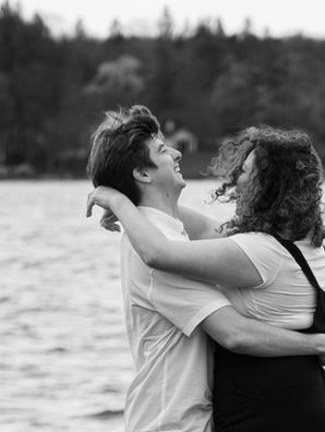 Couple celebrating their surprise proposal at Emerson Park in Auburn NY