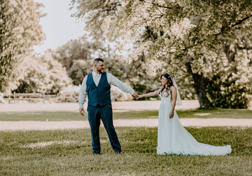 Wedding couple smiling during outdoor ceremony in Central New York
