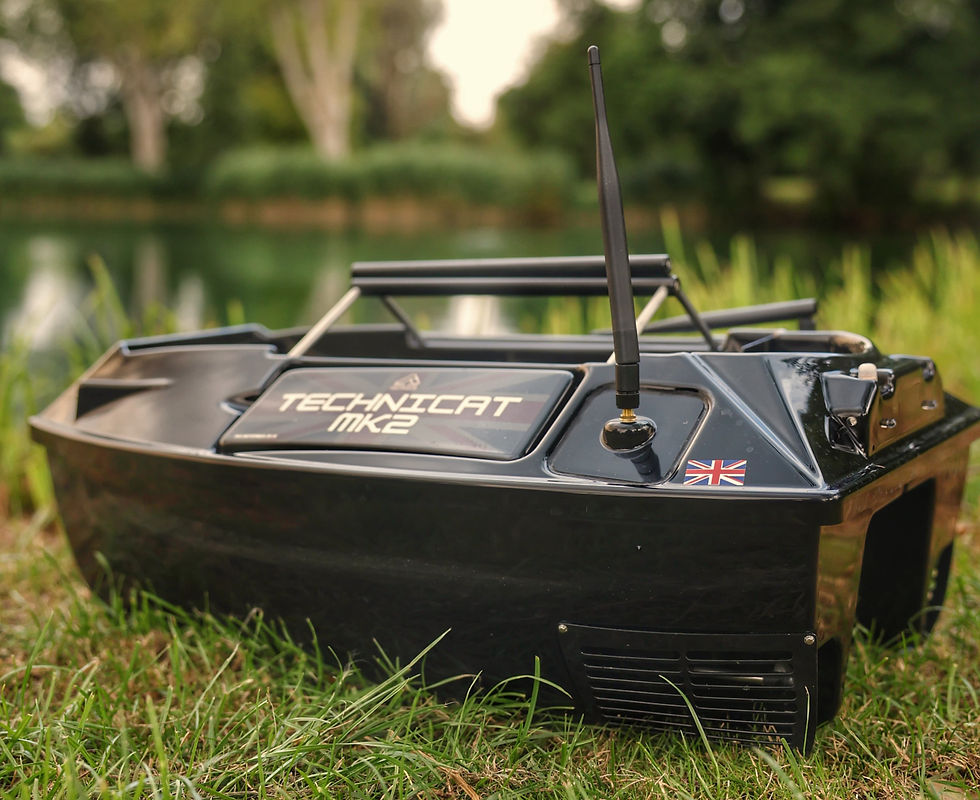 Technicat MK2 Bait Boat by a carp fishing lake