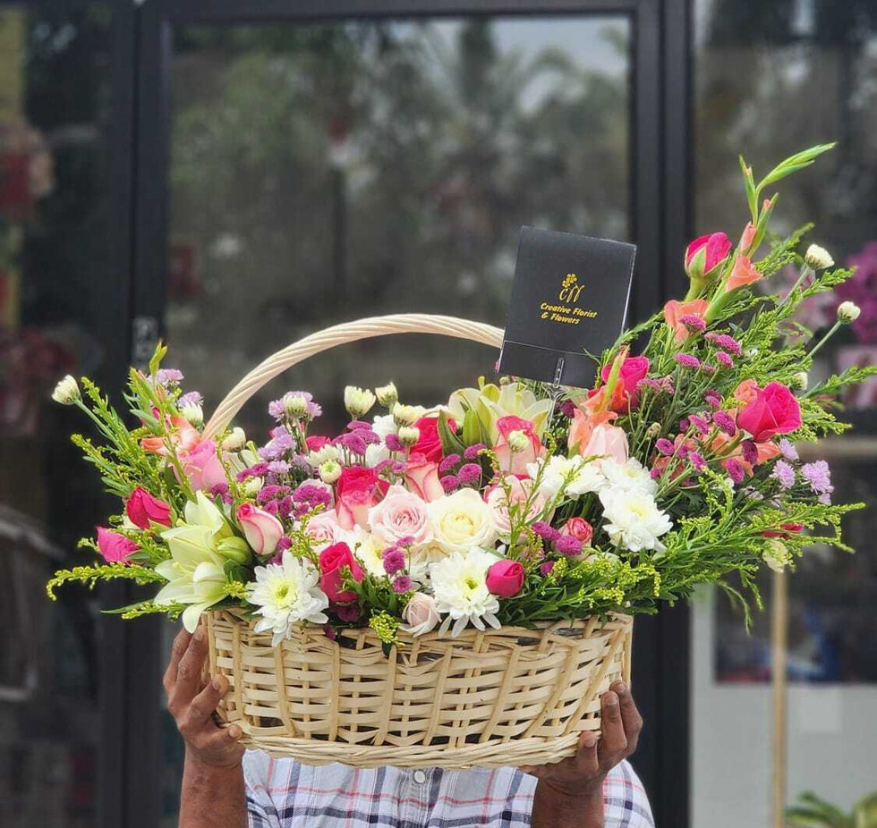 Experience elegance with Delightful flower basket, featuring a stunning mix of roses elegantly arranged in a beautiful basket