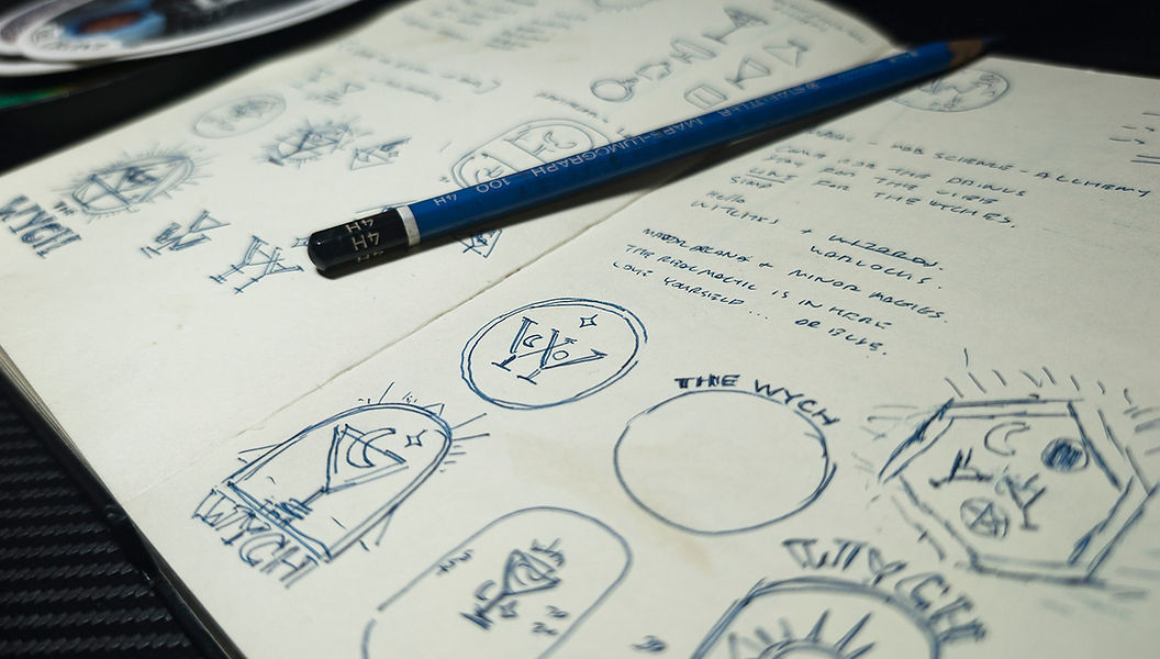 The Wych logo visual identity designs explorations on sketchbook page closeup final