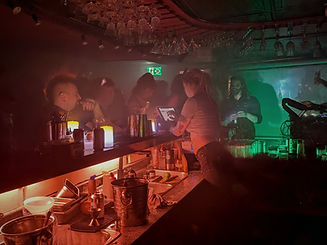 the wych busy dark hazy cocktail dive bar rock night party