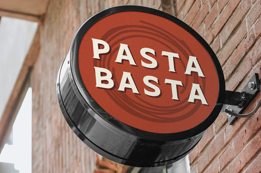 Pastabasta Signage Mockup round logo on black sign on brick wall exterior attachment