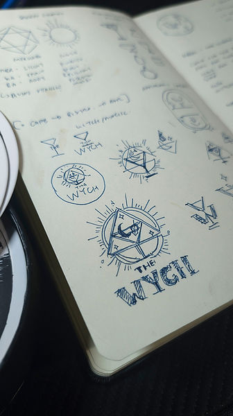 The Wych logo visual identity designs explorations on sketchbook page closeup