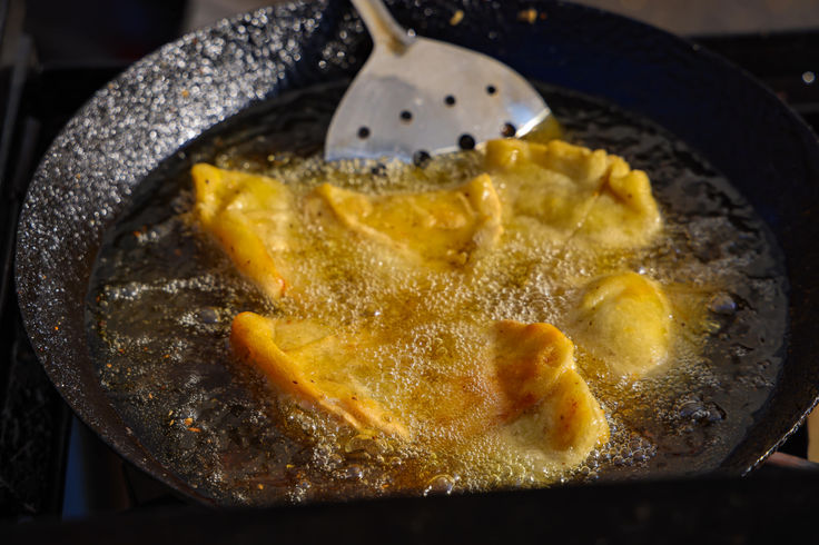 Samosas in a fryer
